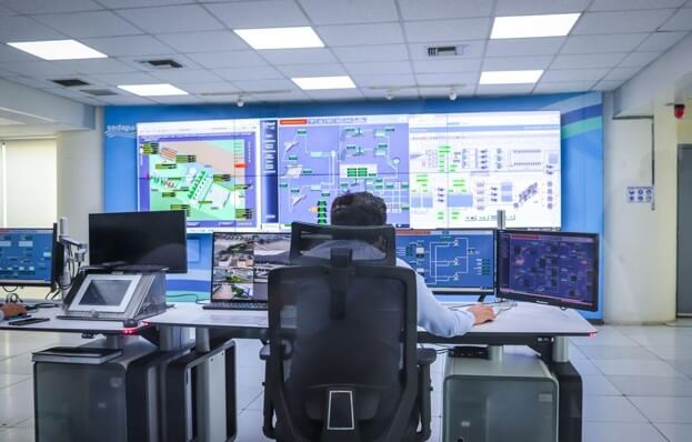 Operator in a modern control room managing technological systems in El Agustino, Lima